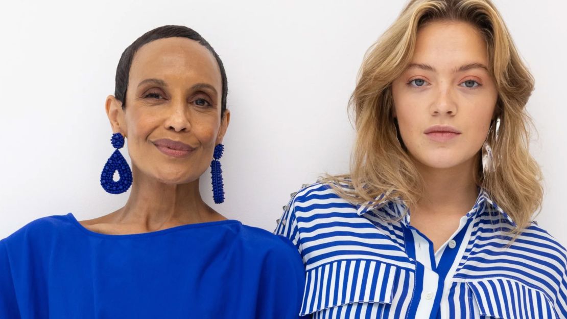 two women standing next to each other wearing ada & edith clothing