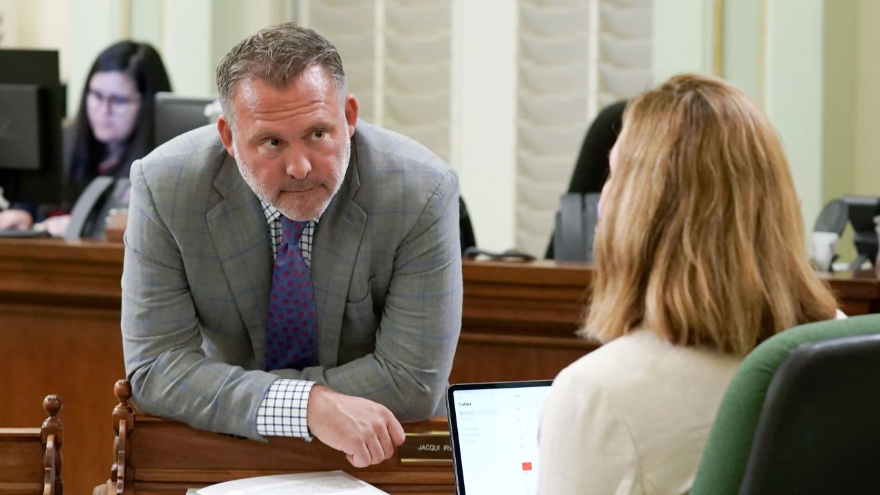 Democratic Assembly member Adam Gray discusses legislation with a colleague at the Capitol in Sacramento, California, on May 25, 2022.