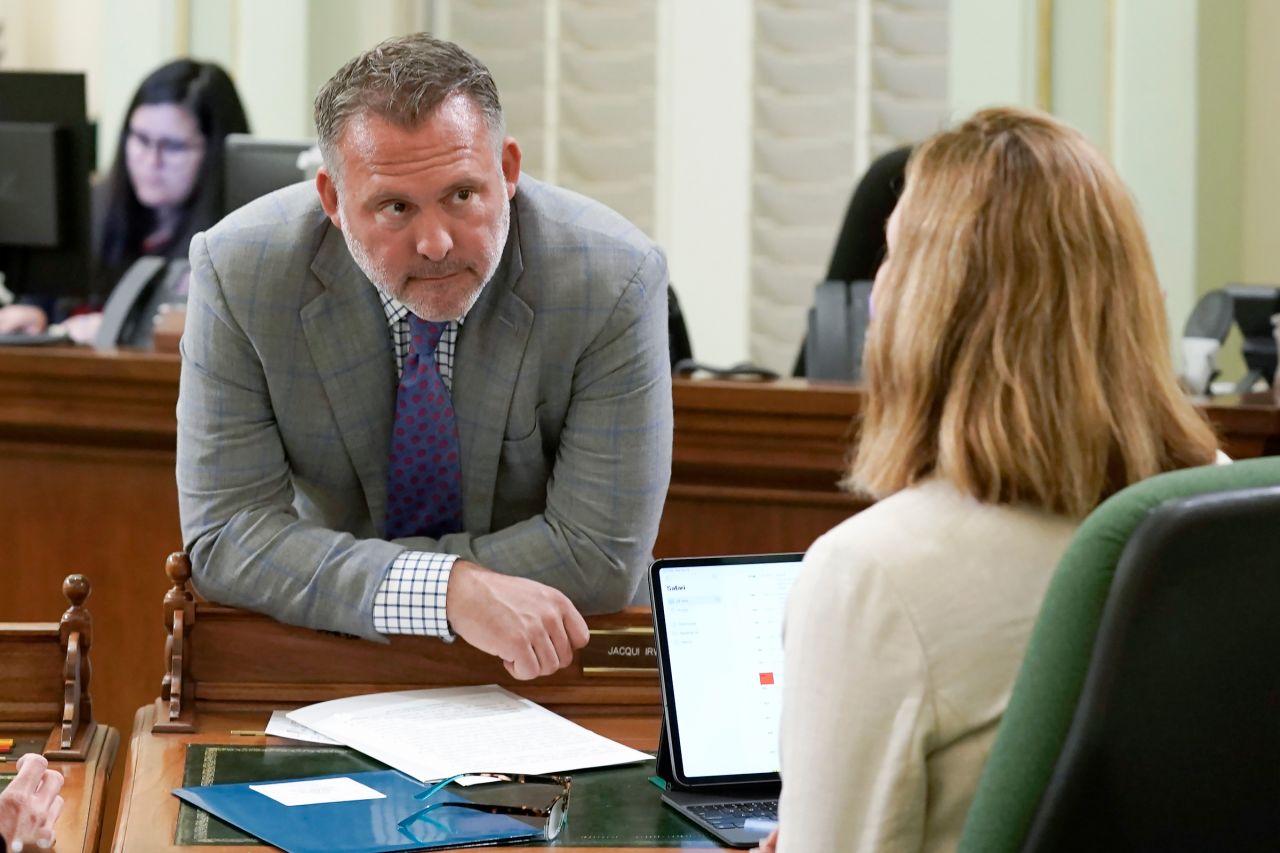 Democratic Assembly member Adam Gray discusses legislation with a colleague at the Capitol in Sacramento, California, on May 25, 2022. 