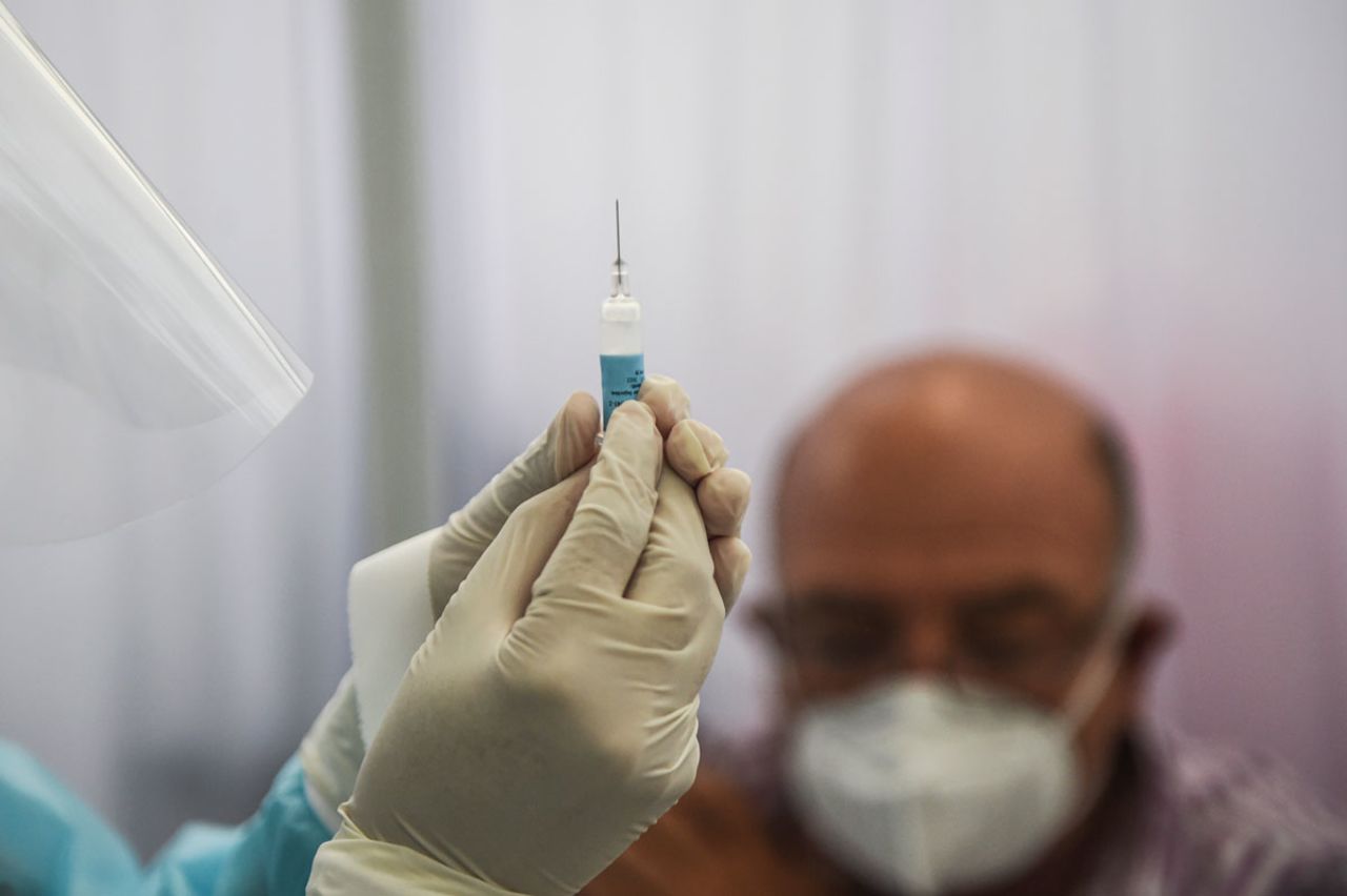 A health worker prepares a syringe to inoculate a volunteer with Sinopharm's Covid-19 vaccine during its trial at the Cayetano Heredia University in Lima, Peru on December 9.