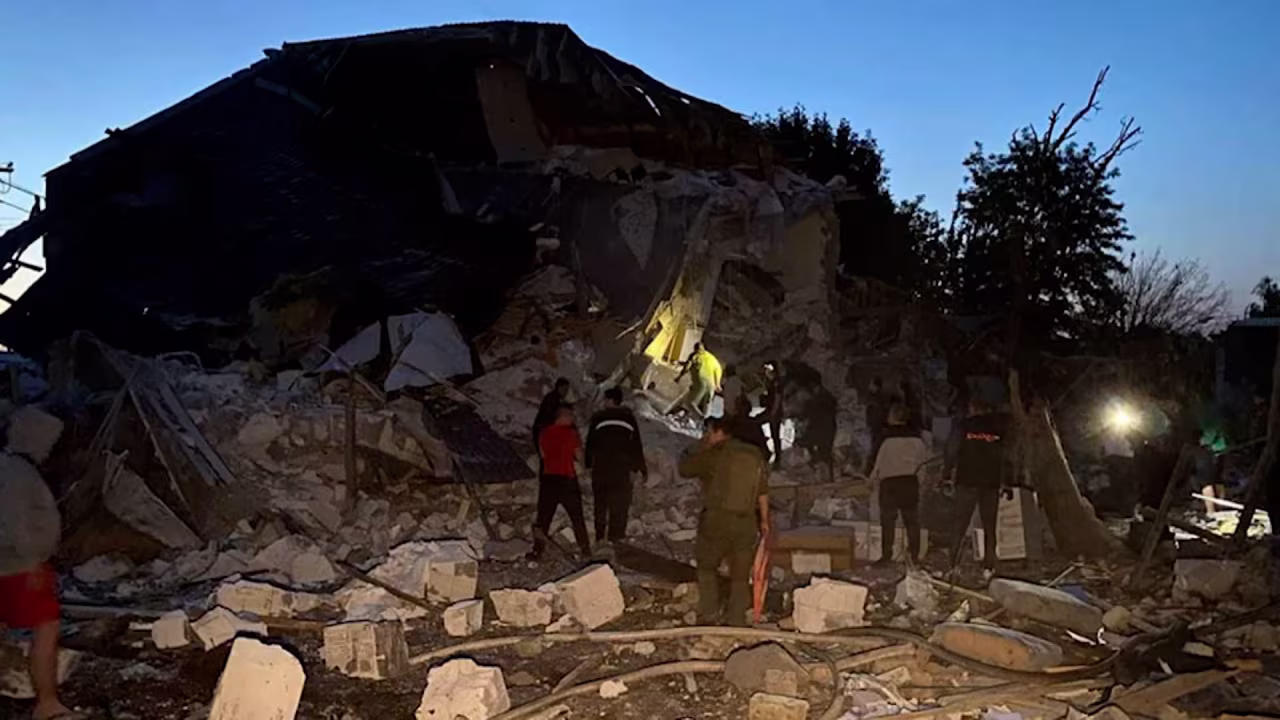 Rescuers work in the aftermath of a Russian attack in Pidhorodne on Saturday. 