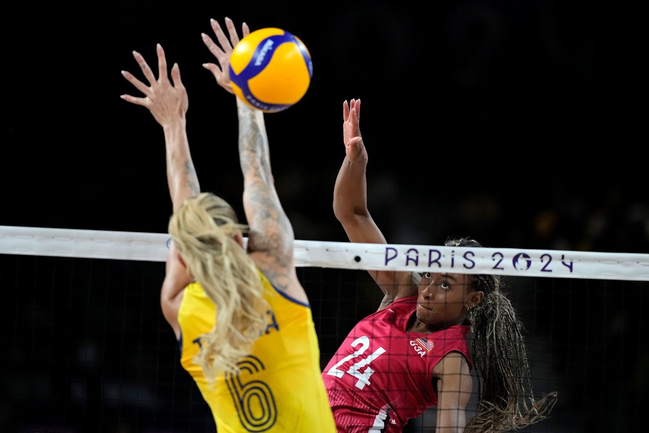 Chiaka Ogbogu of the United States hits the ball past Brazil's Thaisa Daher during their semifinal on Thursday.