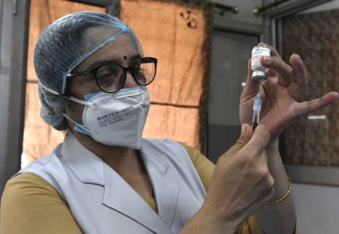A medic prepares a dose of the Covishield vaccine at Hindu Rao Hospital, on March 22, in New Delhi, India. 