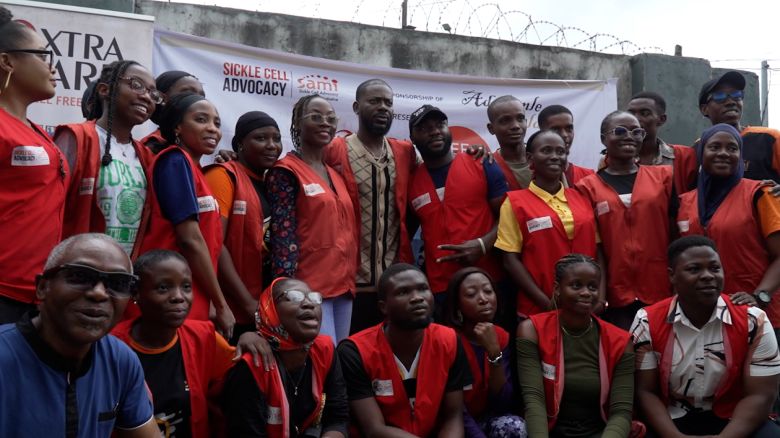 <strong>Nigerian singer Adekunle Gold poses for a photo with volunteers at the Sickle Cell Advocacy and Management Initiatives medical outreach he sponsored at Akerele Primary Healthcare Center in Surelere in Lagos. </strong>