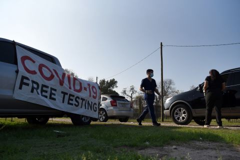 Healthcare workers operate a Covid-19 drive-through testing site in Houston on December 30.