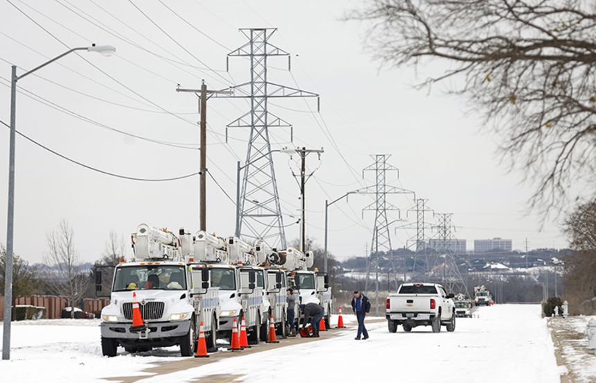 Pike Electric service trucks line up after a snow storm on February 16, in Fort Worth, Texas.