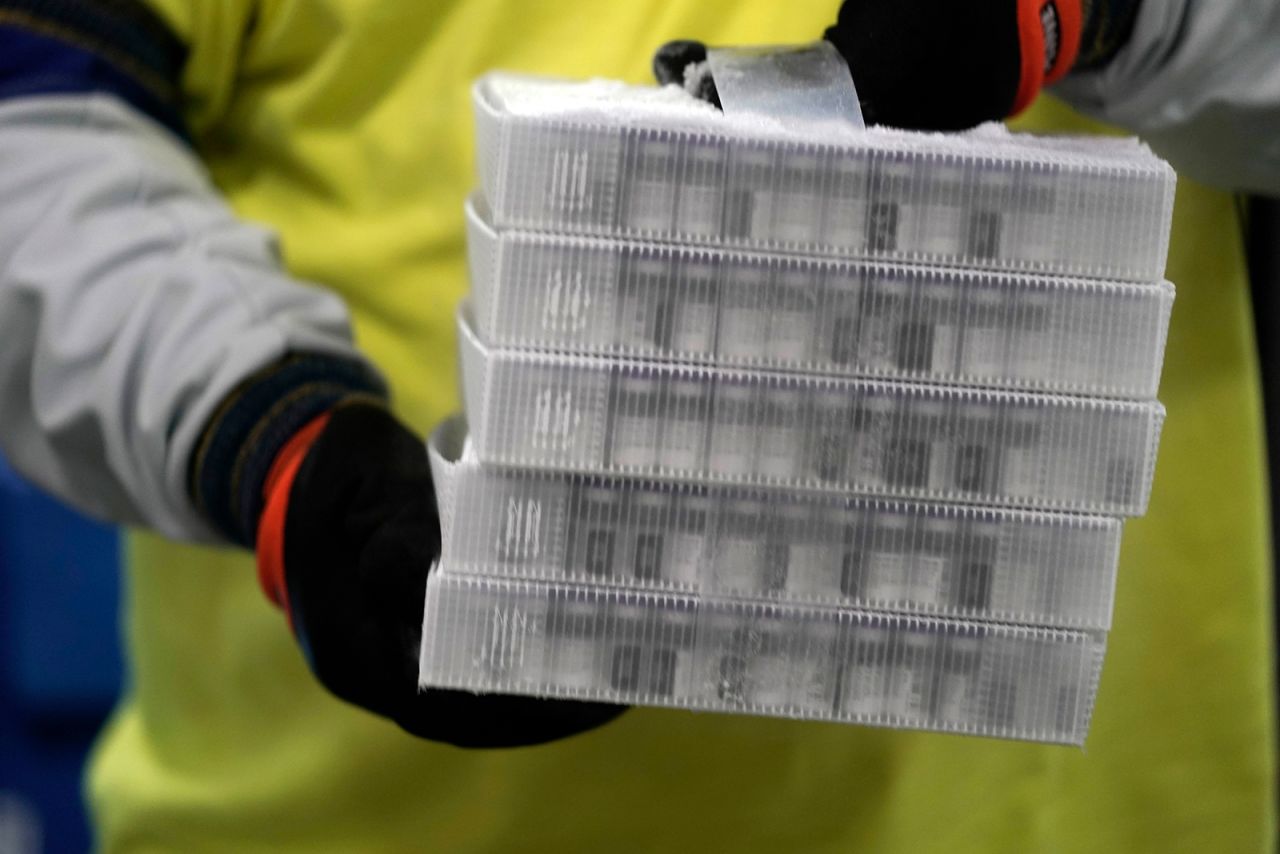 Boxes containing the Pfizer-BioNTech Covid-19 vaccine are prepared to be shipped at the Pfizer Global Supply Kalamazoo manufacturing plant in Portage, Michigan, on December 13.