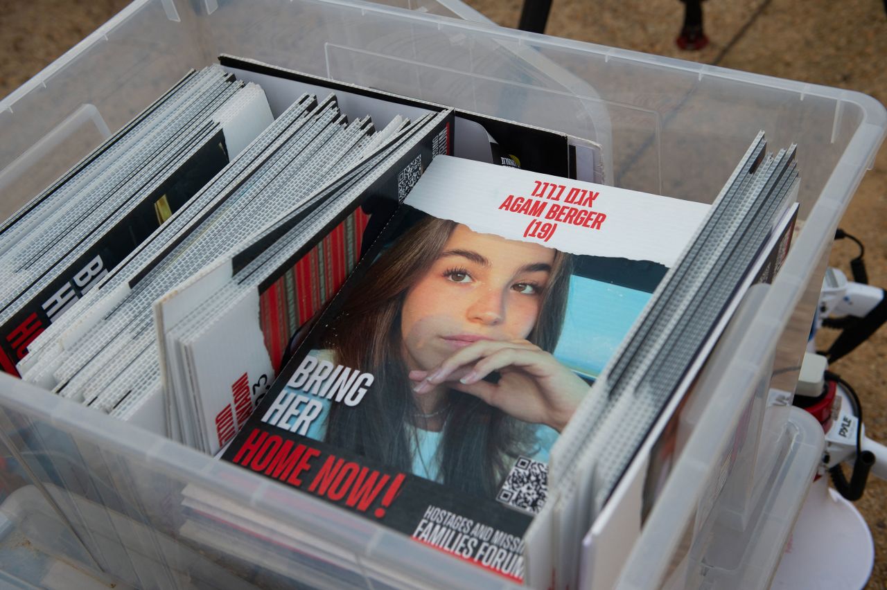 A sign with a photo of 19-year-old hostage Agam Berger is seen as protesters and family members of Israelis held hostage by Hamas hold a rally outside of the US Capitol on the National Mall on Tuesday.