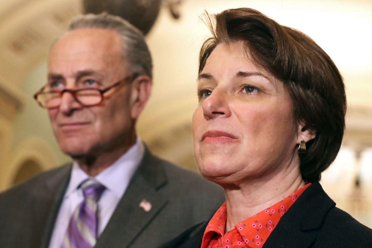 Sen. Amy Klobuchar (D-MN) (R) talks to reporters with Senate Minority Leader Charles Schumer (D-NY) on May 22, 2018 in Washington, DC.