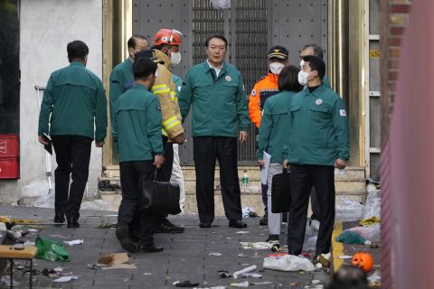 South Korean President Yoon Suk Yeol visits the scene where dozens of people died and were injured in Seoul on Sunday, Oct. 30.