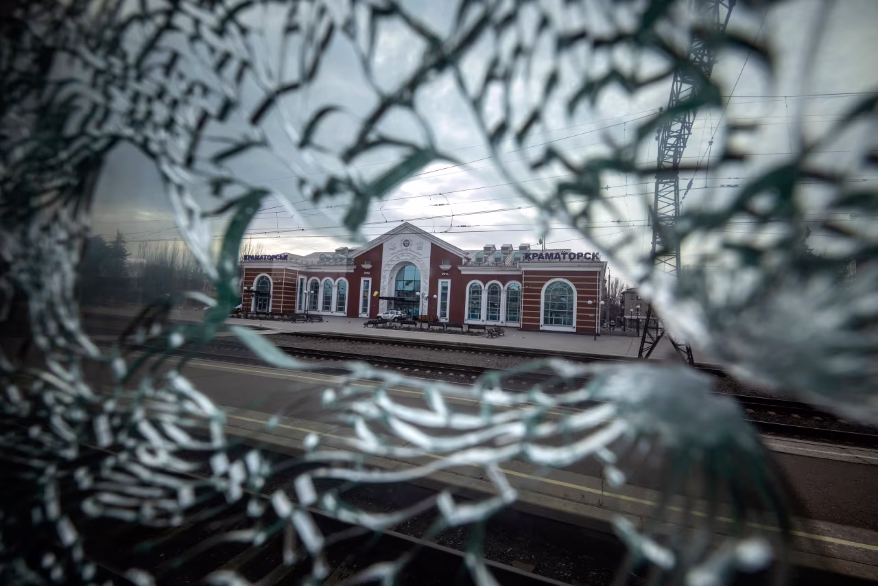 The Kramatorsk train station is seen from the broken window of a train car on April 8.