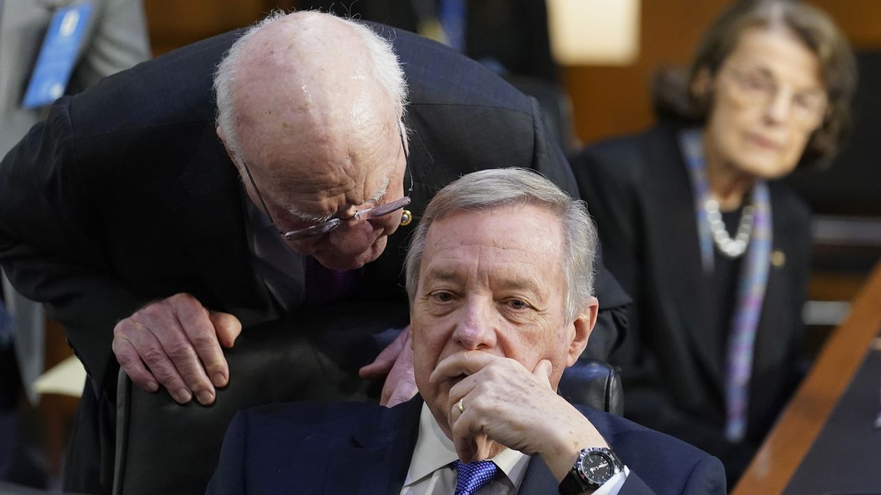 Sen. Patrick Leahy, left, speaks with Senate Judiciary Committee Chairman Sen. Dick Durbin, center, during the confirmation hearing for Supreme Court nominee Judge Ketanji Brown Jackson on Wednesday, March 23, 2022. 