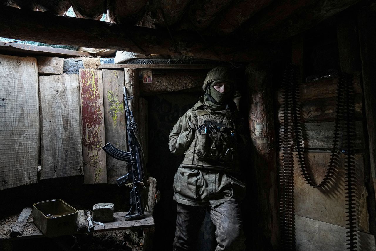 A Ukrainian serviceman stands in a shelter on a position at the line of separation between Ukraine-held territory and rebel-held territory near Zolote, Ukraine, Saturday, Feb. 19.