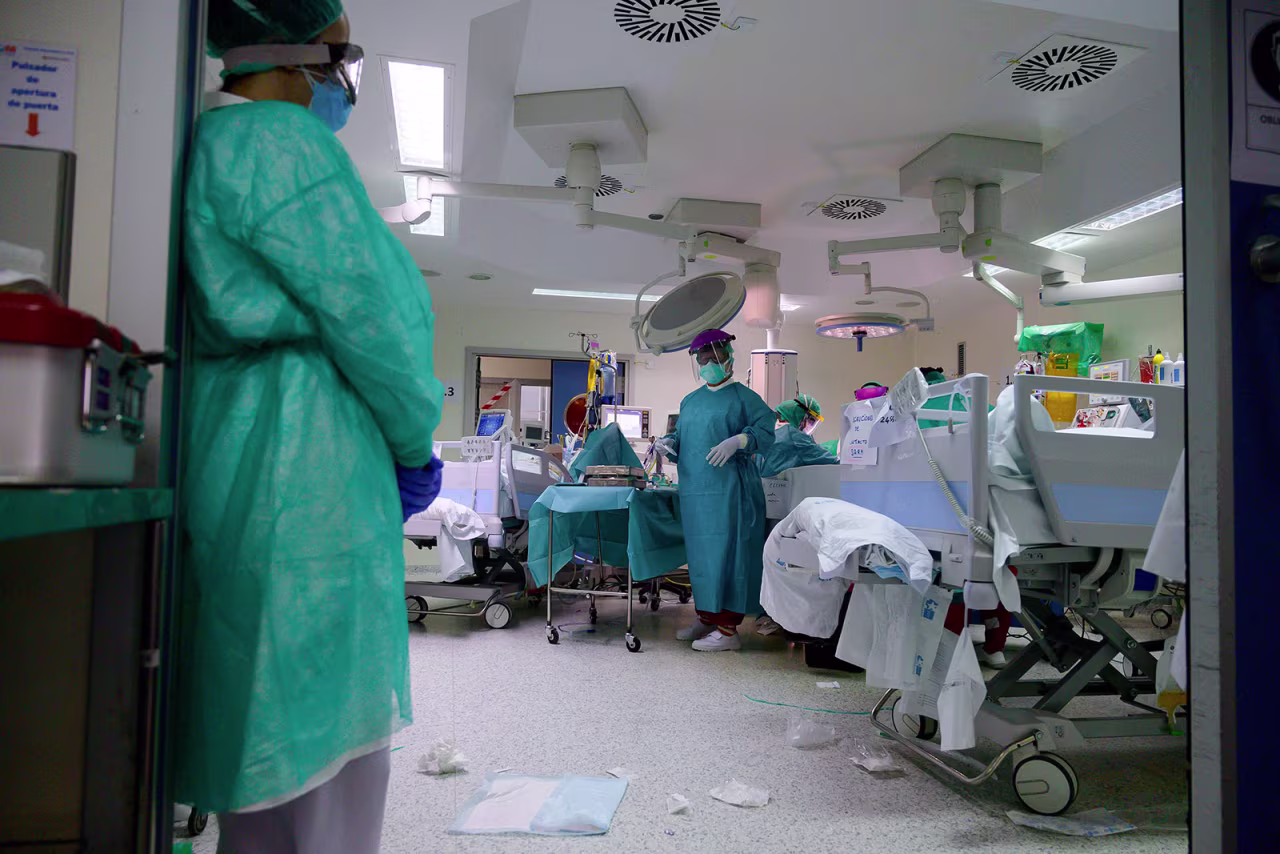 Healthcare workers tend to coronavirus patients at the Intensive Care Unit of the La Paz University Hospital in Madrid on April 23.