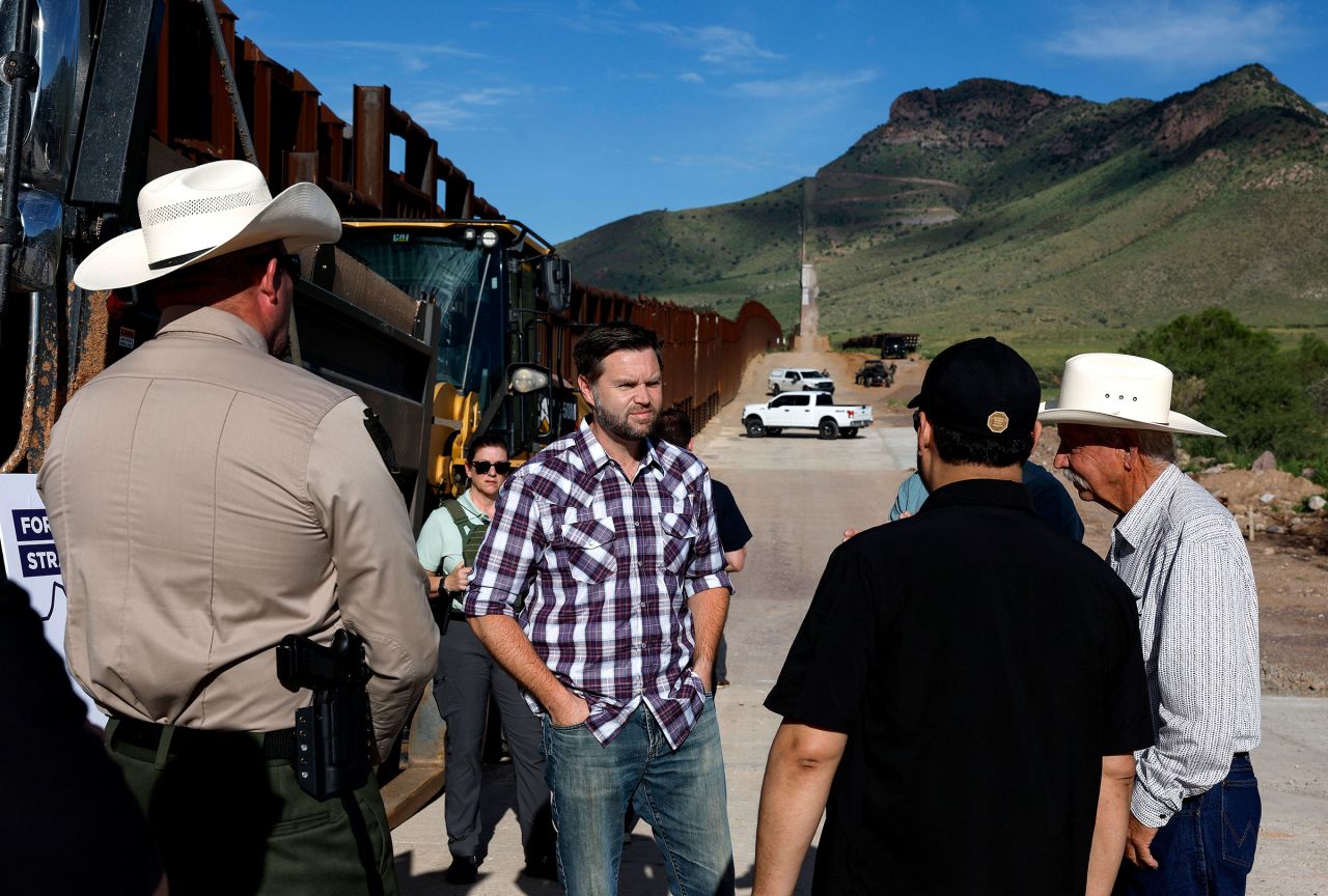 Sen. JD Vance talks with Sheriff Robert Watkins of Cochise County, President of the National Border Patrol Council Paul A. Perez and local ranchers while touring the U.S. Border Wall on August 1 in in Montezuma Pass, Arizona.