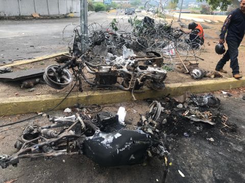Charred motorcycles in the capital Caracas Wednesday.
