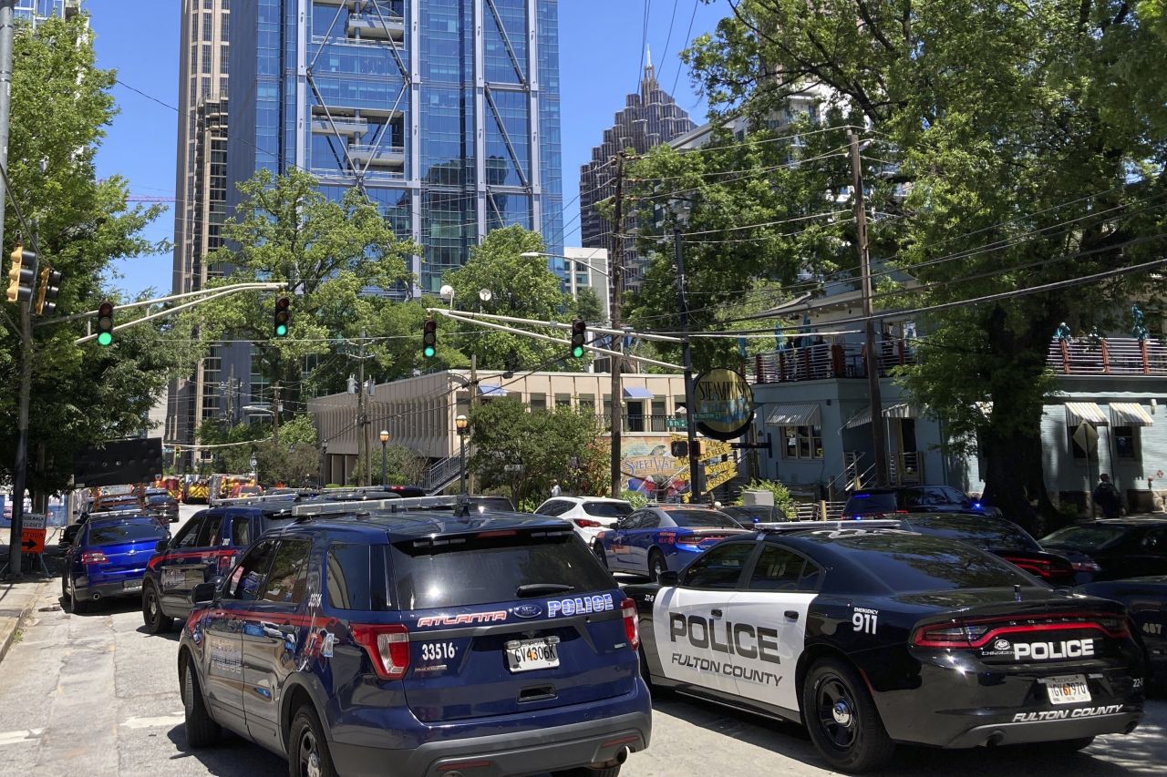 Emergency vehicles arrive on West Peachtree in Atlanta on Wednesday. 