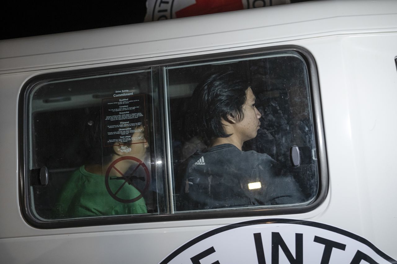 A Red Cross vehicle carrying Thai hostages drives by at the Gaza Strip crossing into Egypt in Rafah on November 25.