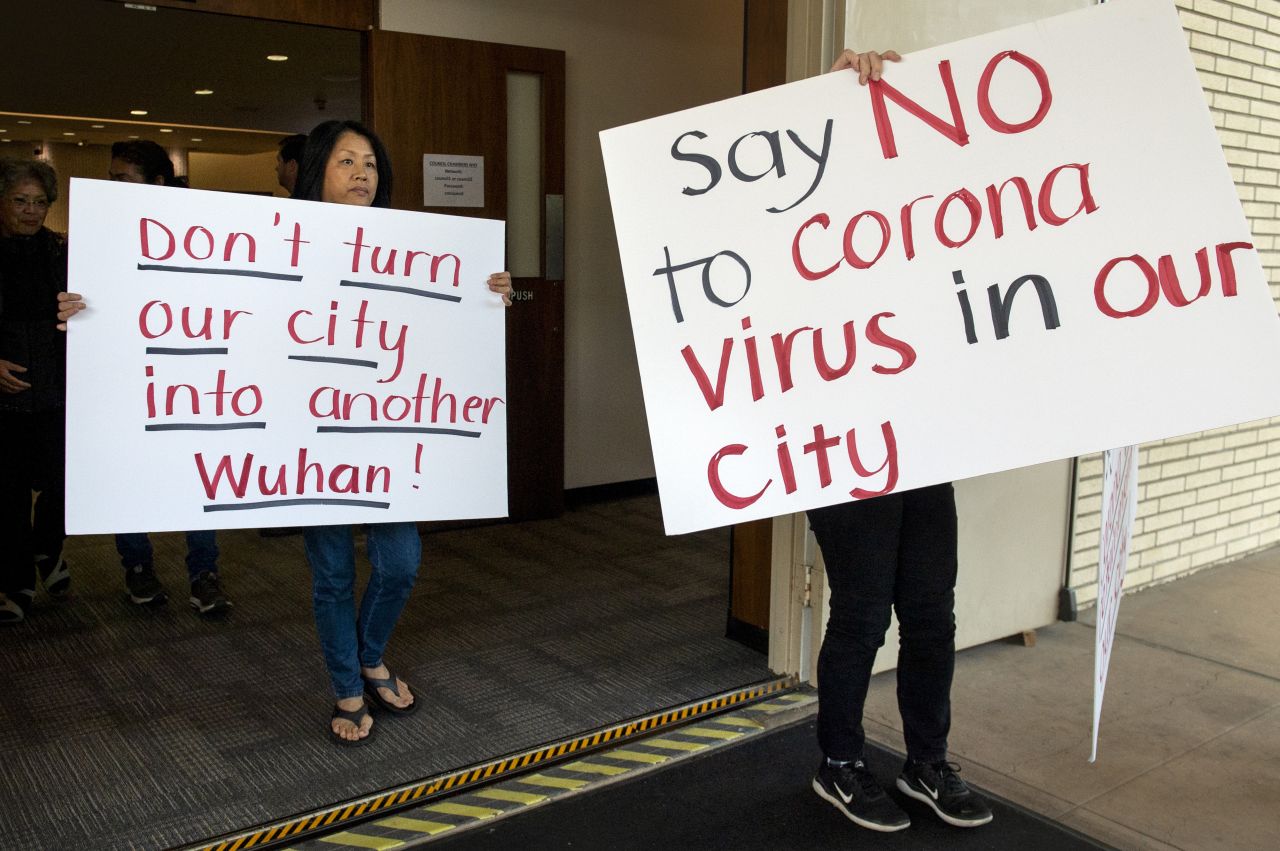 Mary Cahill, left, leaves a news conference where officials discussed the proposal for housing coronavirus patients at the Fairview Development Center in Costa Mesa, California, on Saturday, February 22. A court temporarily blocked the U.S. government from sending up to 50 people infected with a new virus from China to the Southern California city for quarantine after local officials argued that the plan lacked details about how the community would be protected from the outbreak.