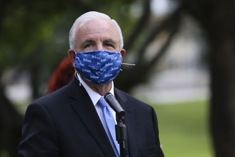 Former mayor of Miami-Dade County Carlos Gimenez speaks during a news conference at a new self-swab Covid-19 drive-thru testing site at Tropical Park in Miami, Florida on July 27.