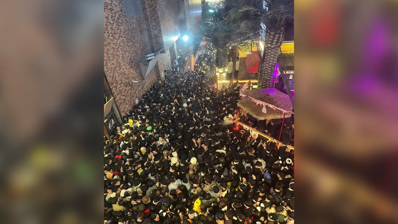 A street in Itaewon district is pictured full of people in Seoul on Saturday night. 