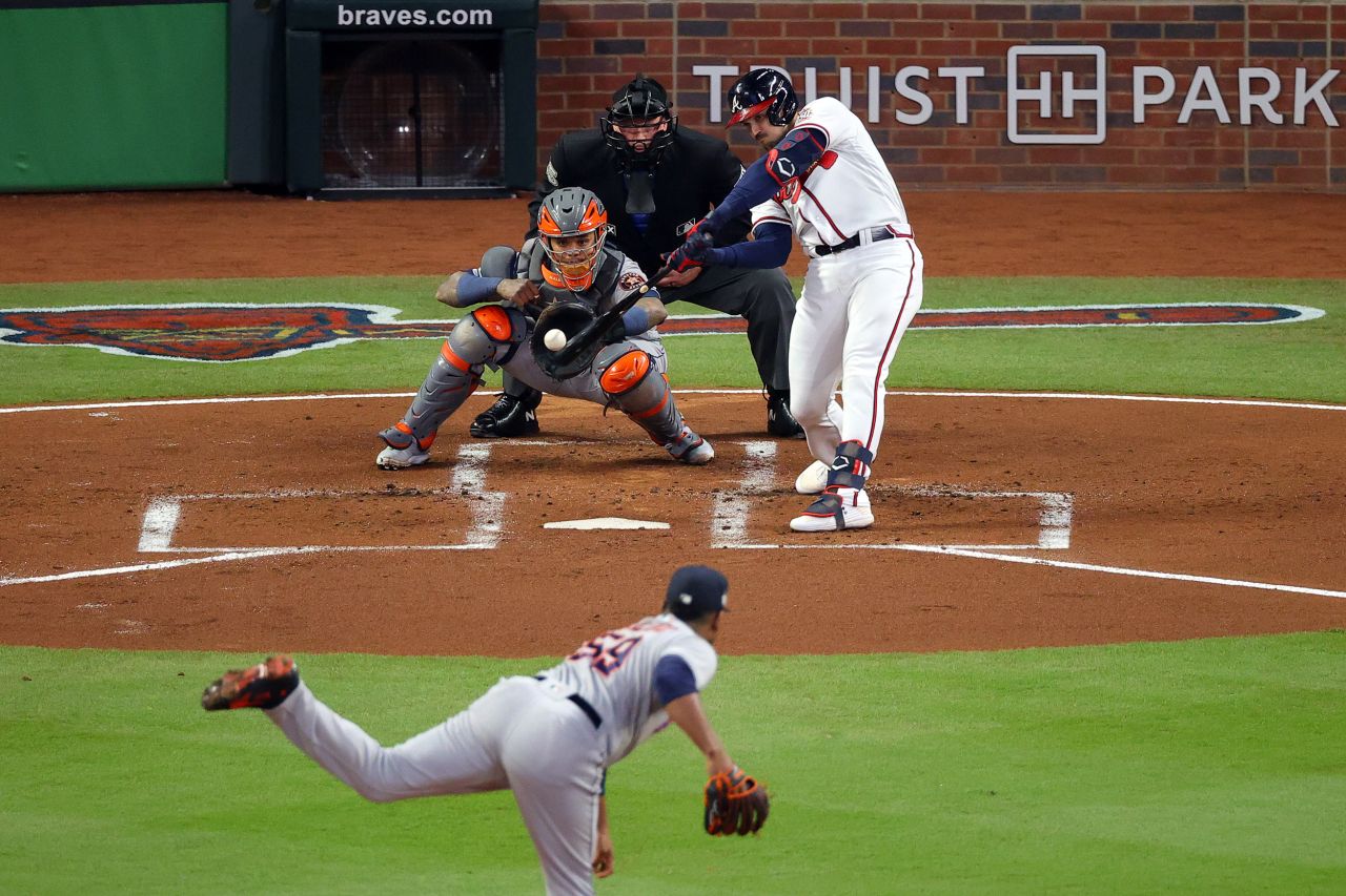 Adam Duvall of the Braves hits a grand slam home run during the first inning in Game 5.