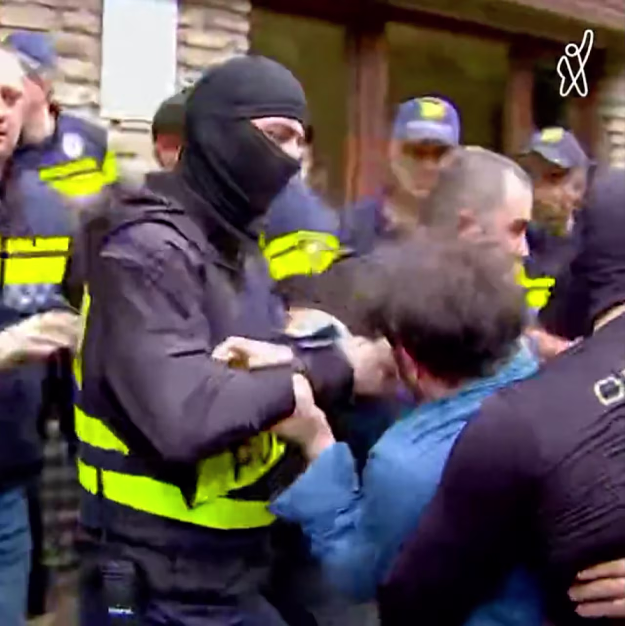 Police removed several people outside the Kvareli Lake Hotel in Georgia on May 20. 