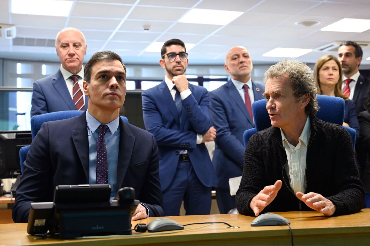 Spanish Prime Minister Pedro Sanchez, left, discusses coronavirus cases with Fernando Simon, director of Spain's Center of Coordination of Health Emergencies, in Madrid on March 4.