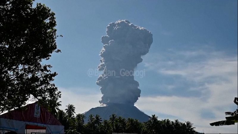 Ash column rises from Indonesian volcano amid rain and flash floods