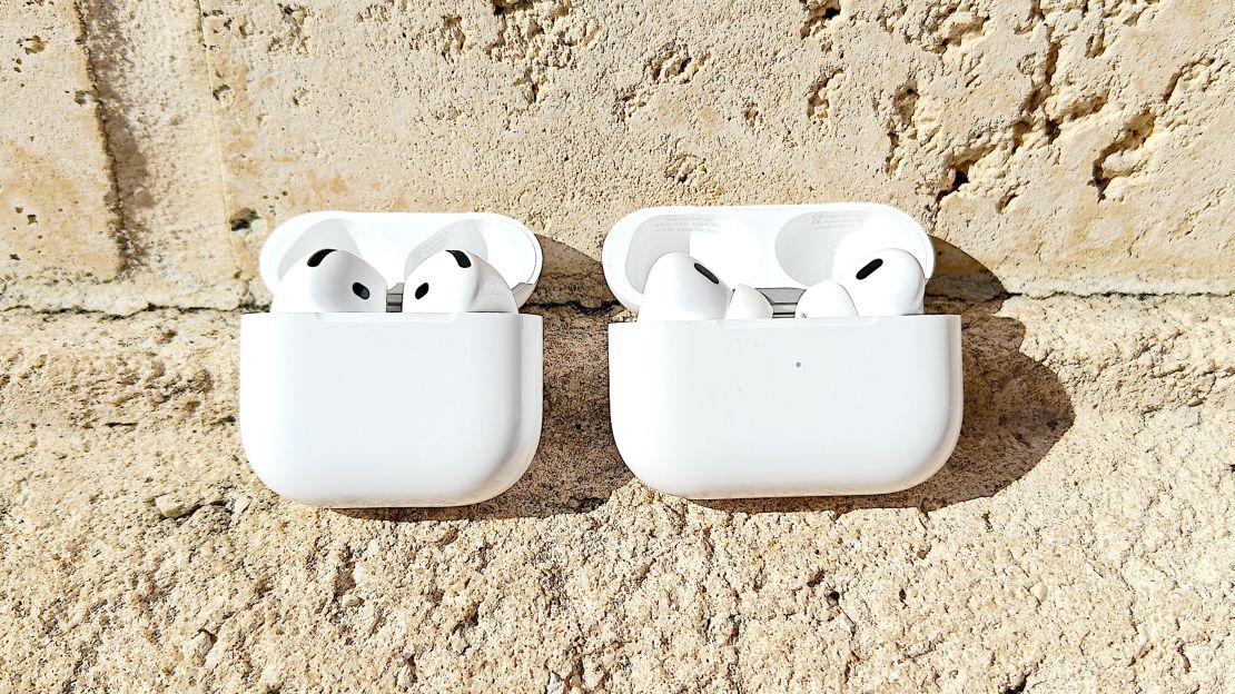 Airpods 4 and Airpods Pro 2 next to each other.