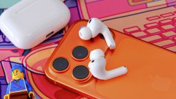 Apple AirPods Pro 3 on top of an iPhone.