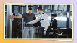 A photo of a person being screened by airport security