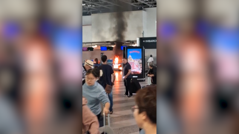 Panic in Milan airport as man sets fire to check-in desk Panic in Milan airport as man sets fire to check-in desk
