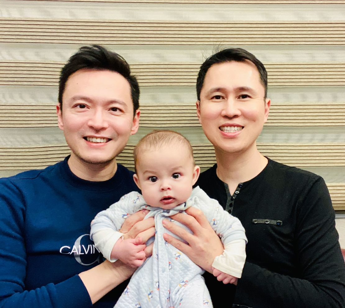 Hung and Huang with their baby boy, Aiden.
