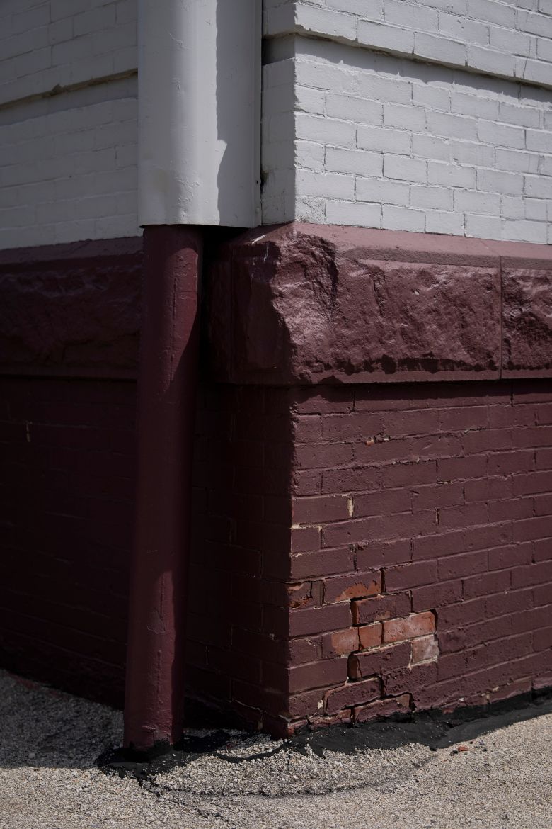 Chipped paint on the facade of Westside Academy, a school currently closed due to lead hazards.