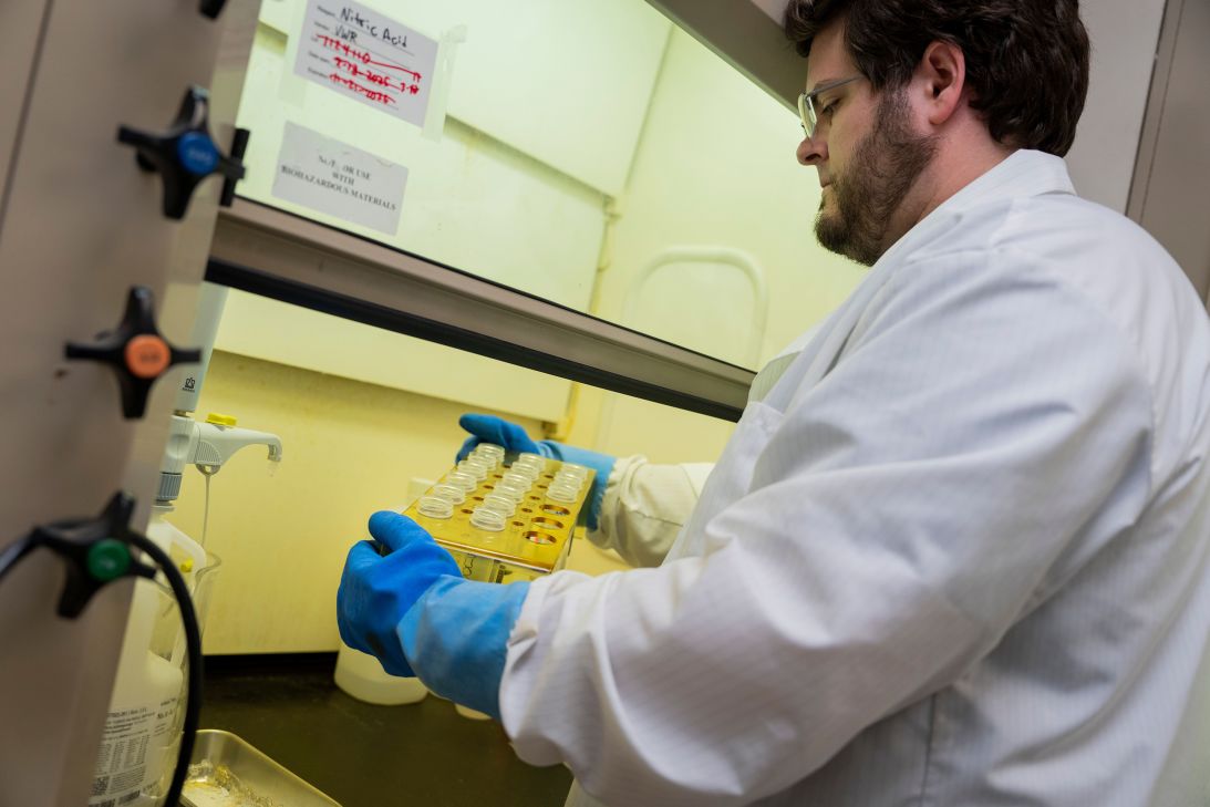 Jeremiah Erickson, a chemist, tests lead samples at the Milwaukee Health Department. The city has a plan to investigate lead risks in dozens of school buildings in the months ahead.