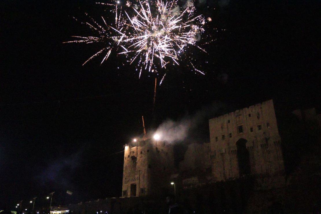 Celebrations at the Aleppo Citadel medieval palace after the Syrian government's landmark agreement with the Syrian Democratic Forces