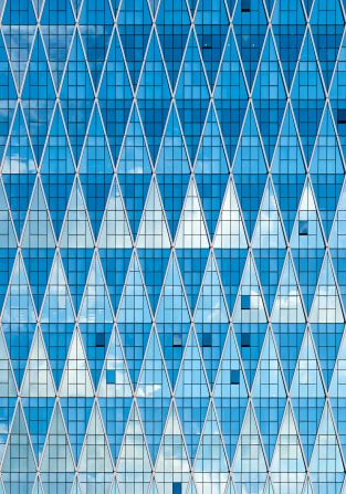 AlJazeera Tower, Abu Dhabi: Another contemporary building, the Al Jazeera Tower, was commissioned in 2010 and completed in 2016. The diamond pattern on its facade echoes the geometric shapes of older buildings.