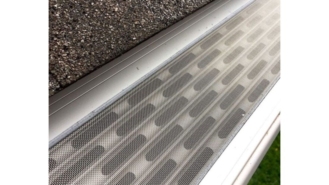 Close-up of an All American Gutter Protection micro-mesh and anodized steel gutter guard