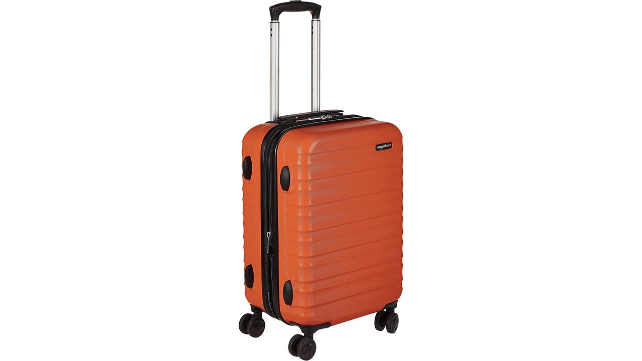 A photo of the Amazon Basics 20-Inch Hardside Spinner in orange