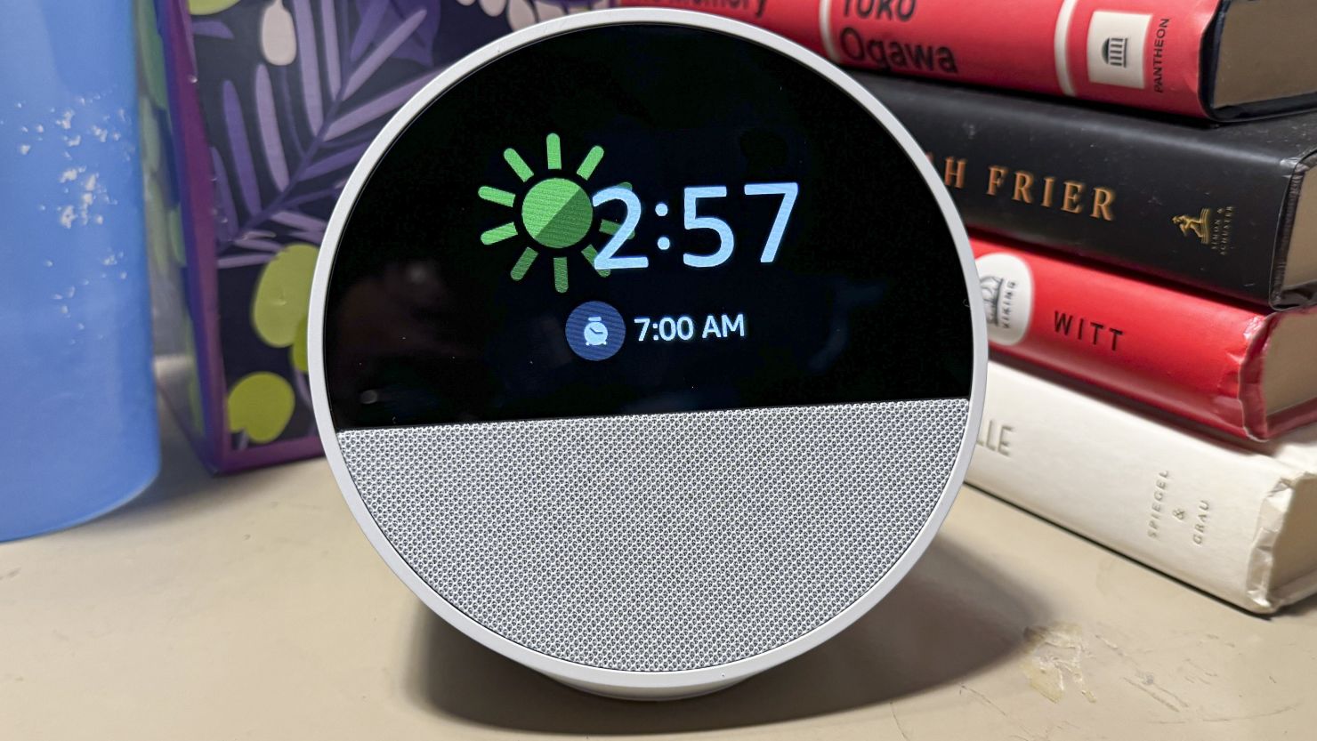 Amazon Echo Spot with the time 2:57, a sunny icon and a 7am alarm time