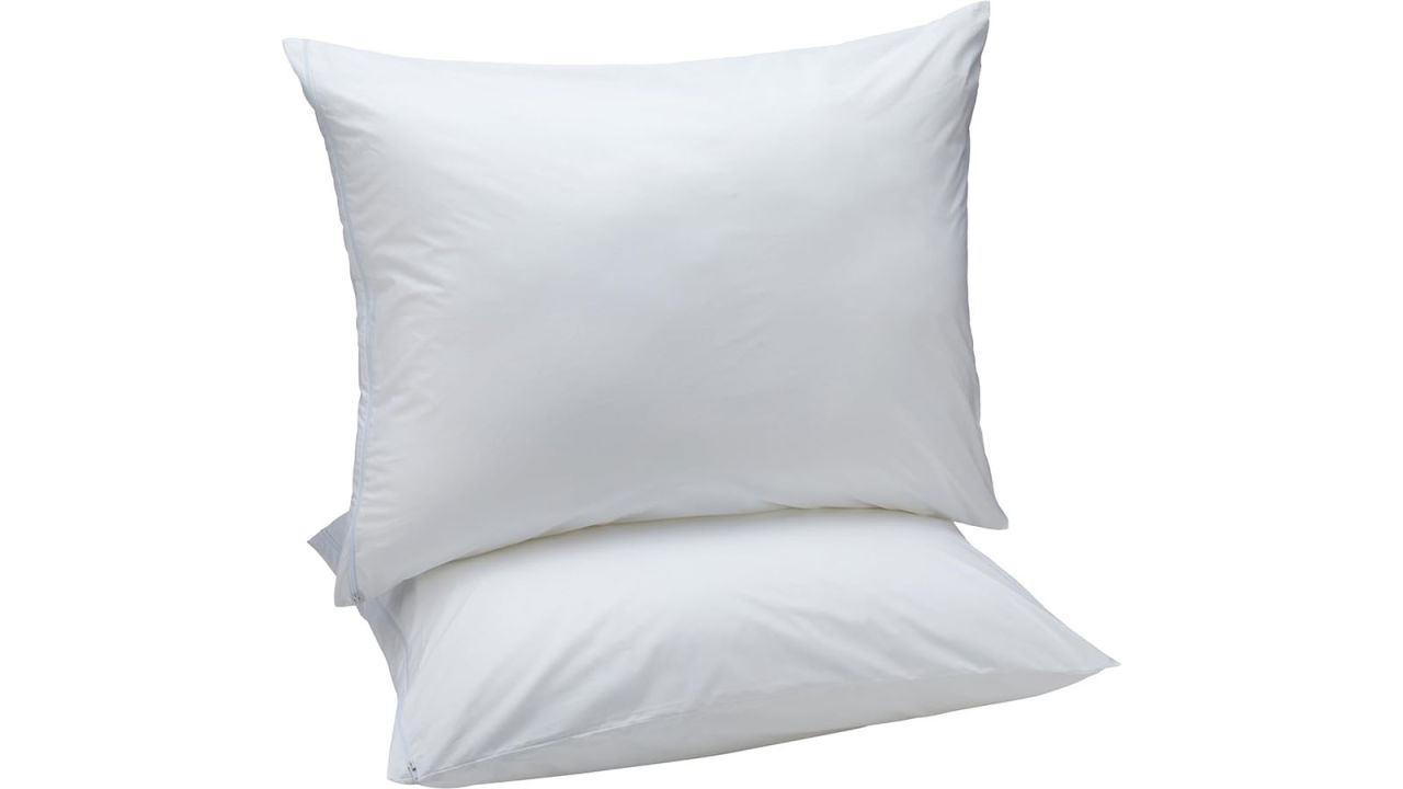 Two white pillows stacked on top of each other.