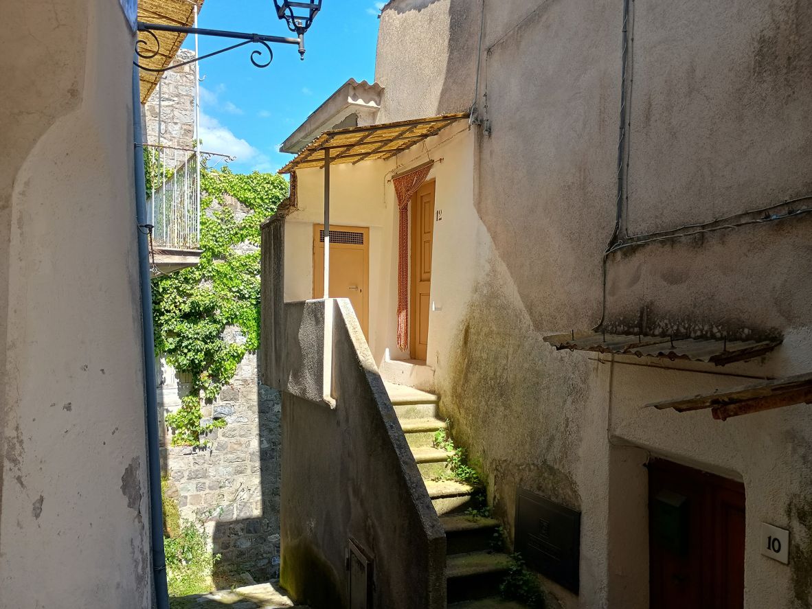 <strong>Bargain home:</strong> Butler purchased this one-bedroom home, which has a balcony overlooking the area’s valley and mountains, for 12,500 euros ($14,500).