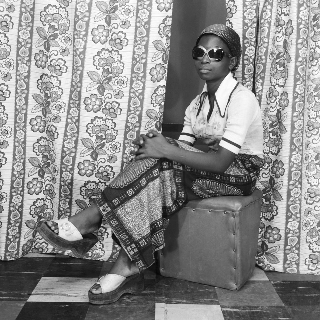 A woman posing in Abi Morocco Photos studio in Lagos, around the 1970s.