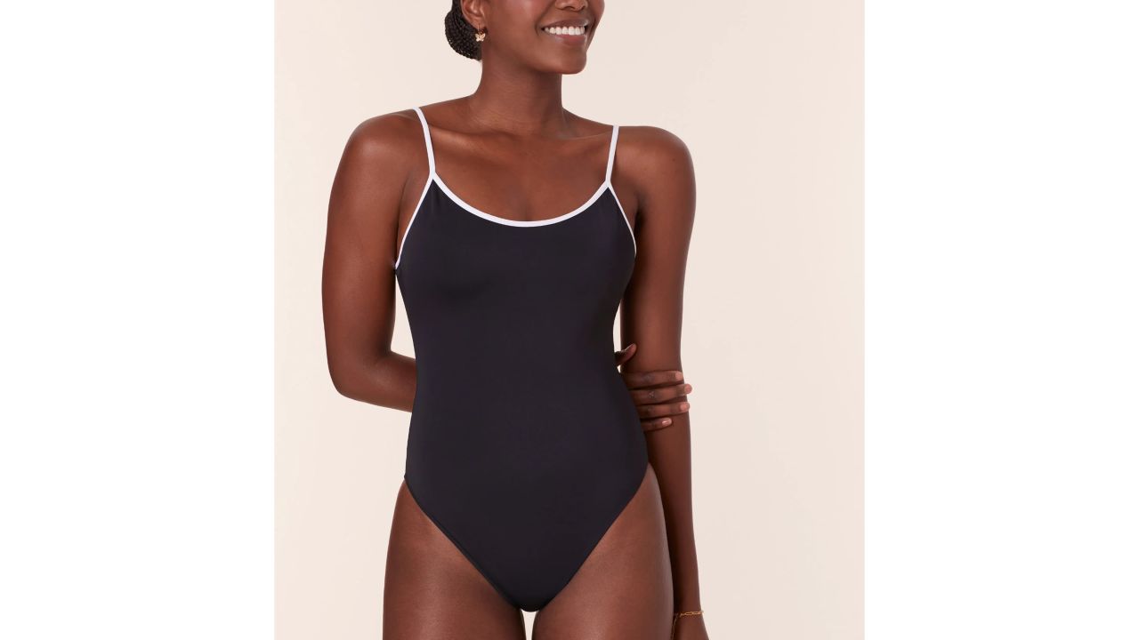 Woman wearing the andie the bells one-piece swimsuit in black