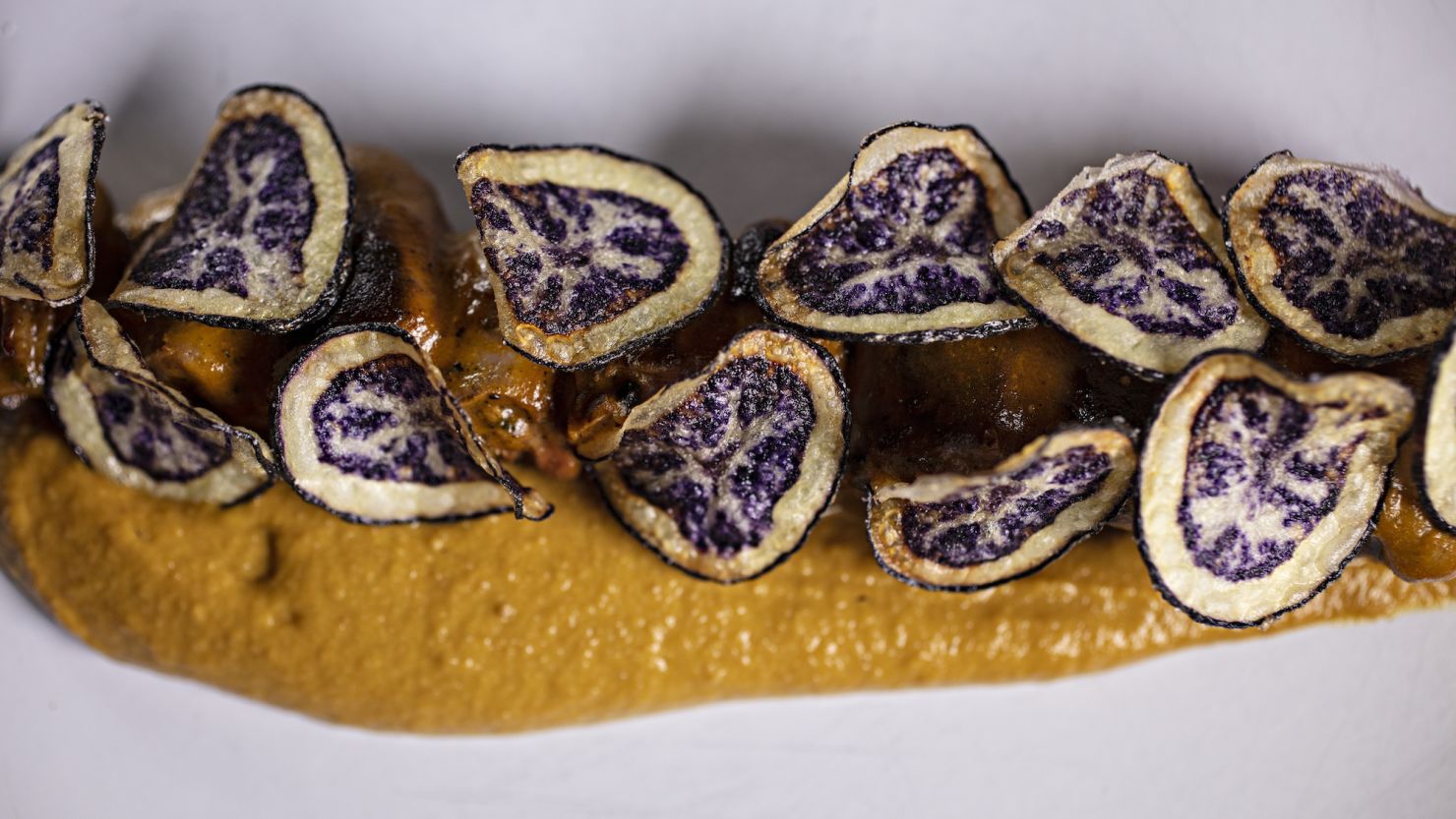 <em>Anticucho</em> (beef heart brochette) with <em>pinta boca </em>potatoes and <em>aji </em>cream with peanuts at Ancestral in La Paz.