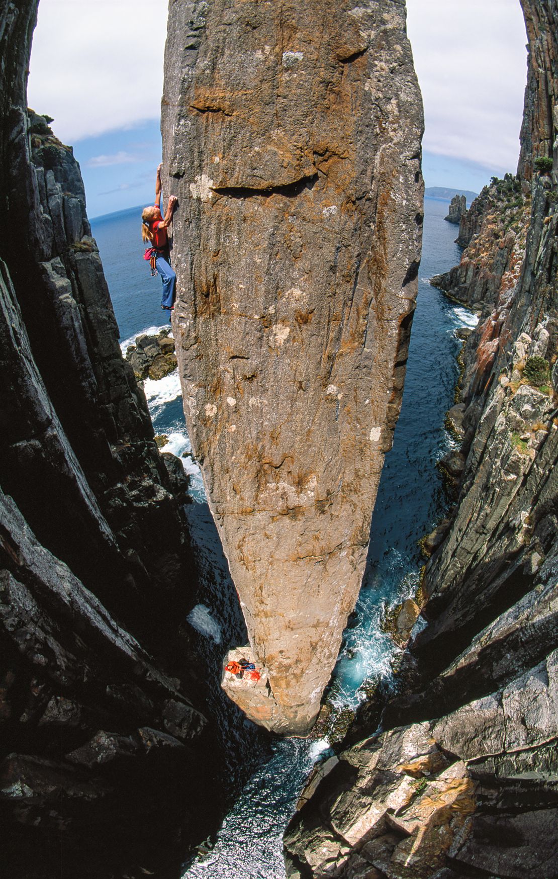 Climber Monique Forestier pictured ascending the Totem Pole, a 213-foot-tall dolerite column at Cape Hauy in Tasmania, Australia, in 2003.