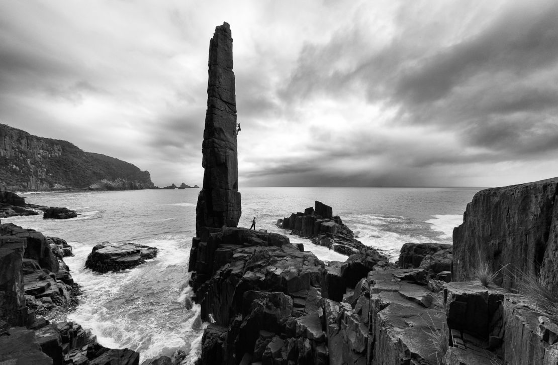 Climbers take on The Moai, a sea stack in Tasmania, Australia.