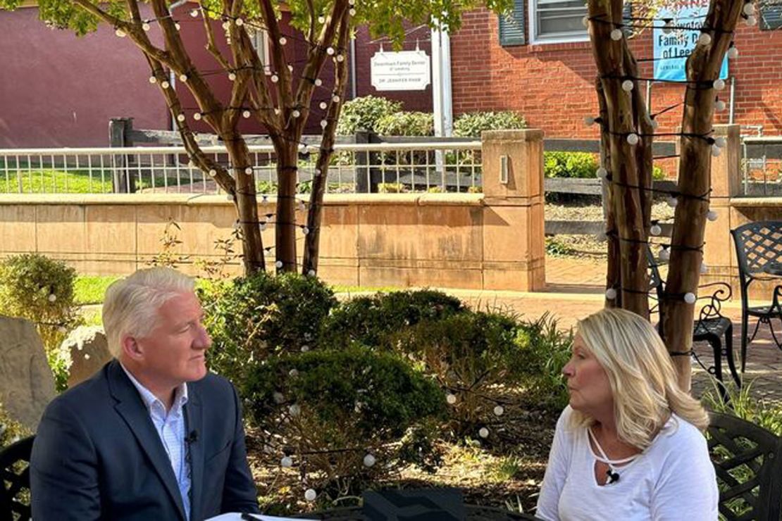 John King talks to Loudoun County voter Nanette Mees in Leesburg, Virginia, in October. 