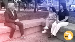 John King talks with Michigan voters Anushka Jalitsagi and Jade Grey in Ann Arbor, Michigan.